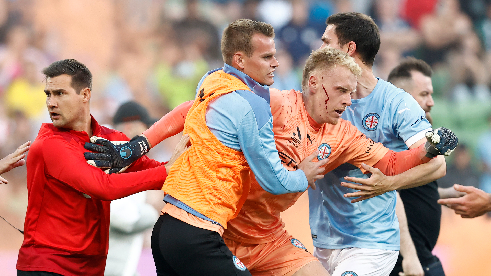 Three men charged after Melbourne derby invasion