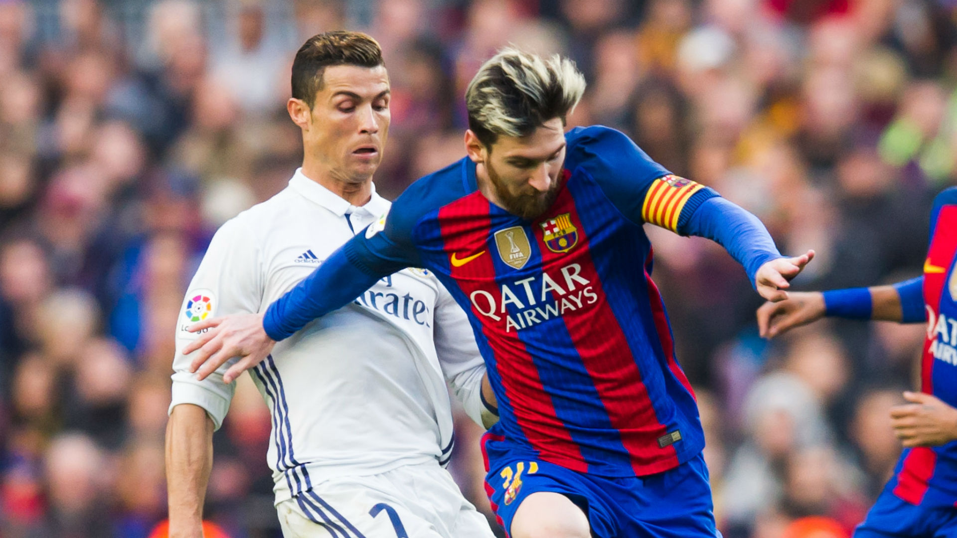 Lionel messi and cristiano ronaldo in a playful moment