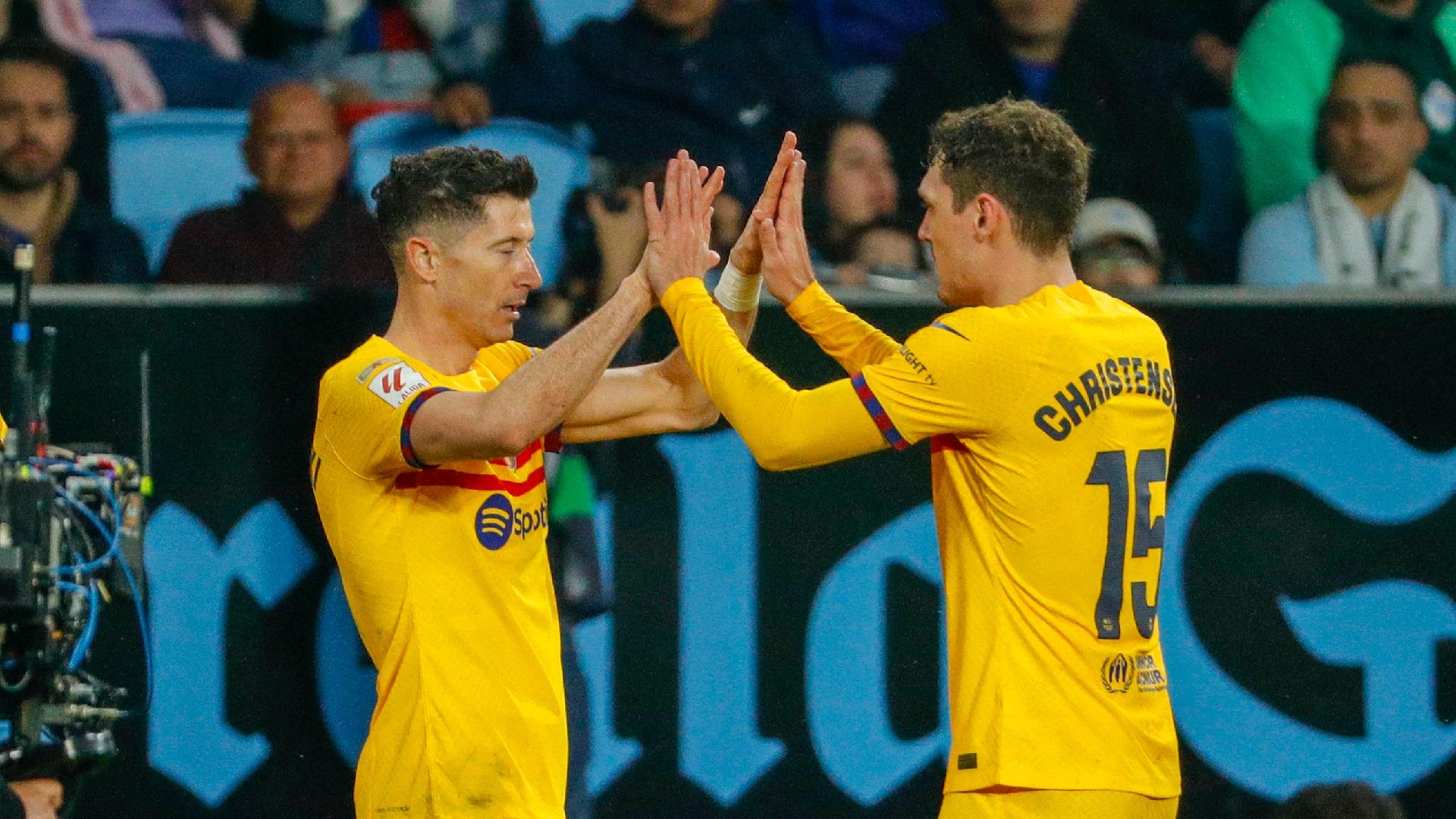 Robert Lewandowski’s retaken penalty gives Barcelona late win at Celta Vigo