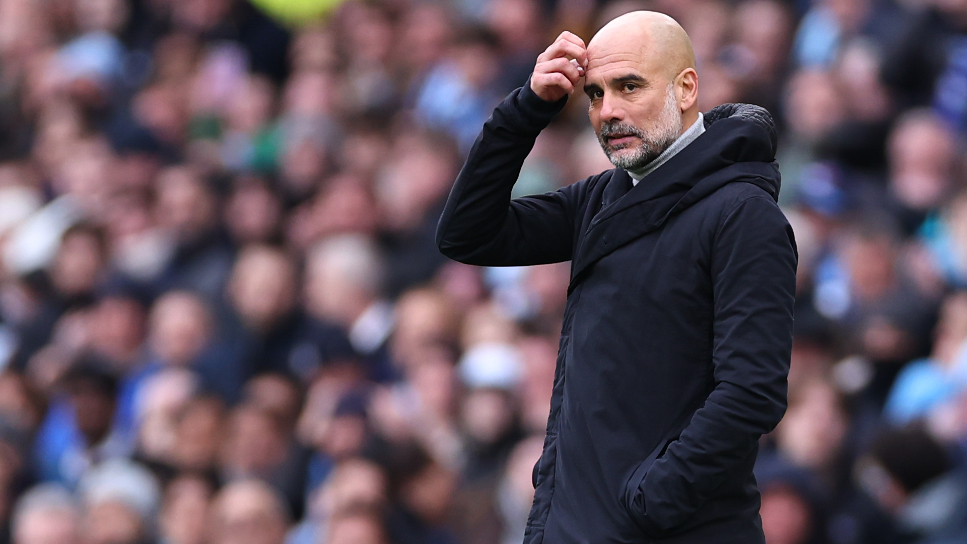 Guardiola expects drawn-out race