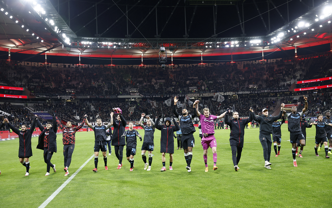 Bayer Leverkusen players celebrate after the match