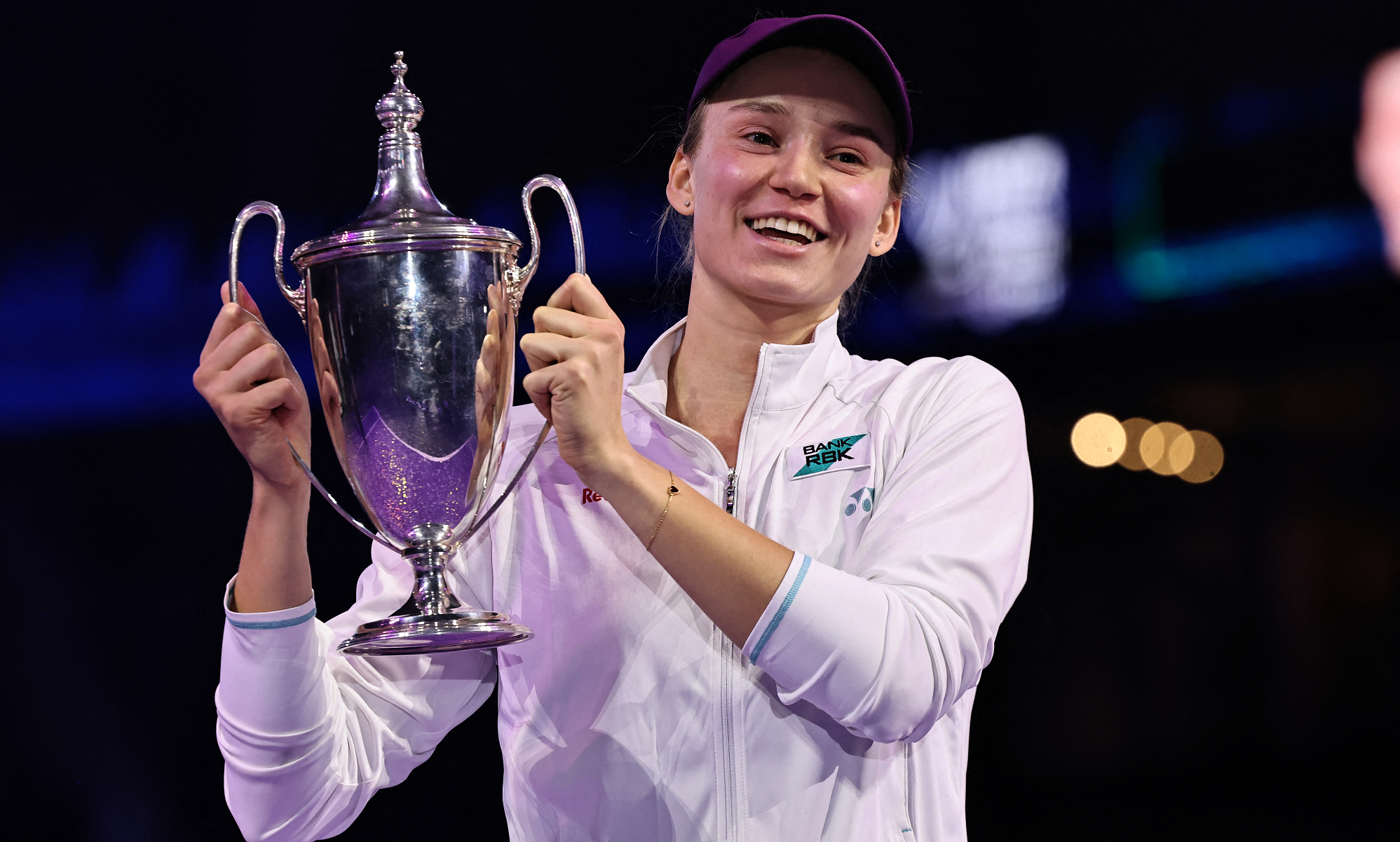 Elena Rybakina lifts the trophy
