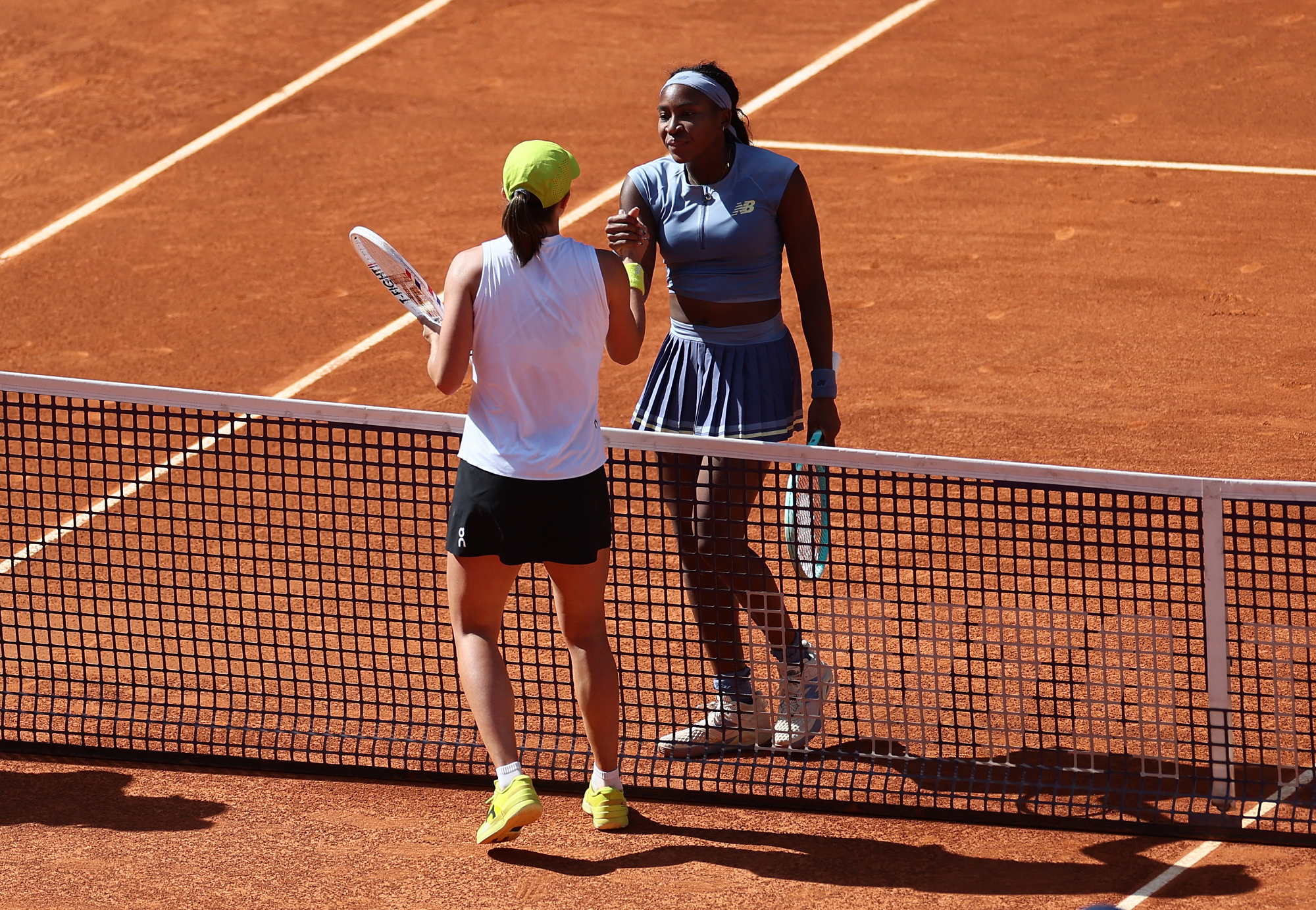 Gauff shakes hands with Iga Swiatek
