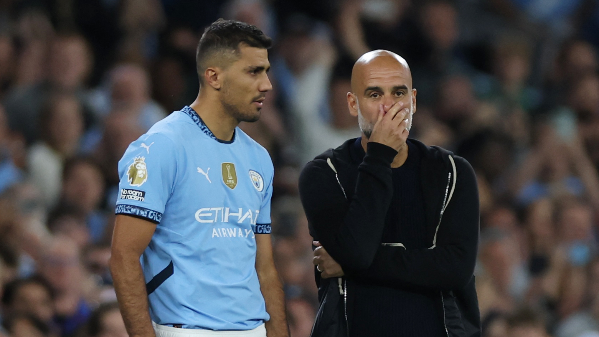 Pep Guardiola y Rodri Hernández