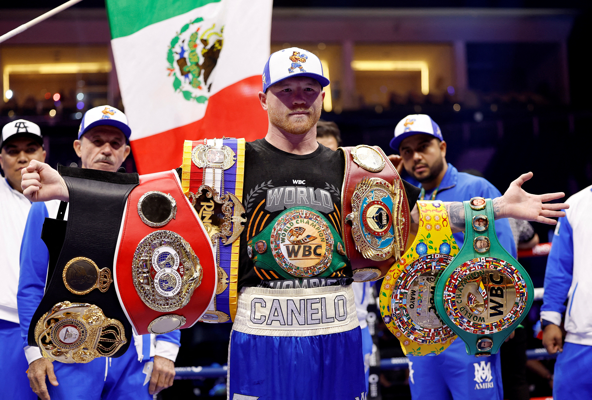 Saul 'Canelo' Alvarez poses with belts