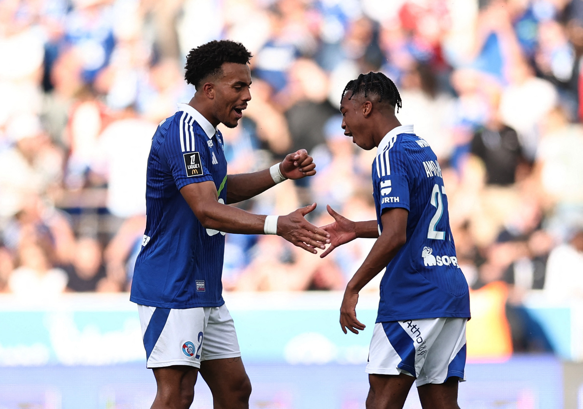 Strasbourg's Guela Doue and Samuel Amo-Ameyaw